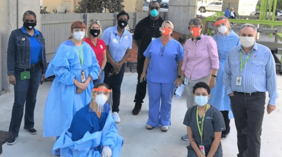 Group of masked medical professionals, data made an impact in the COVID-19 pandemic